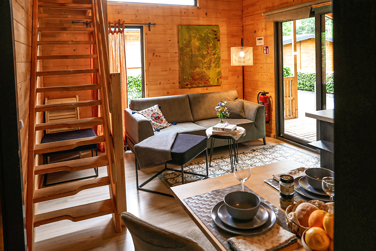 Living area of the Chalet Ardenne Duplex with stairs to the upper floor